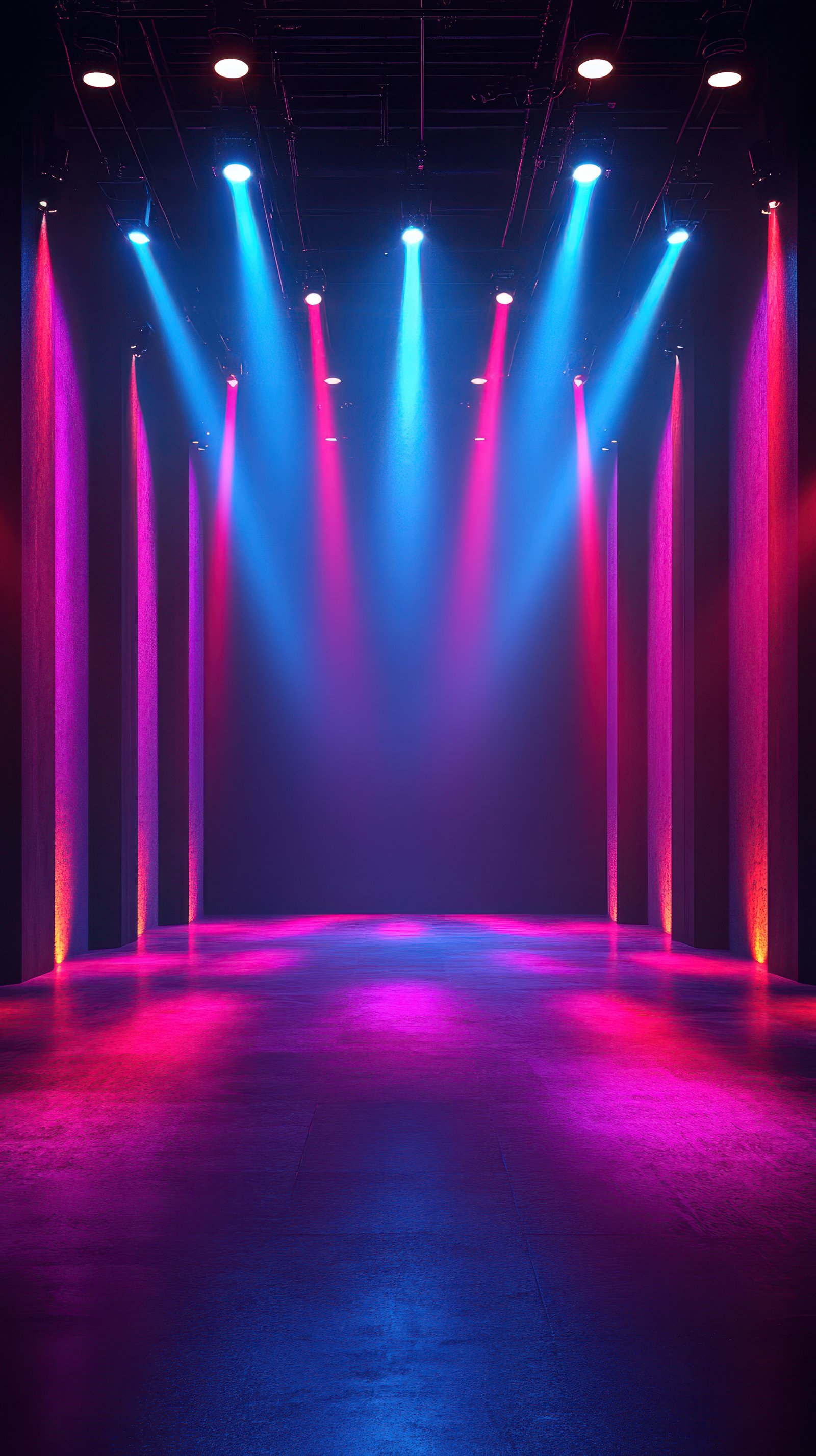 Colorful stage lights illuminate an empty performance space ready for a show